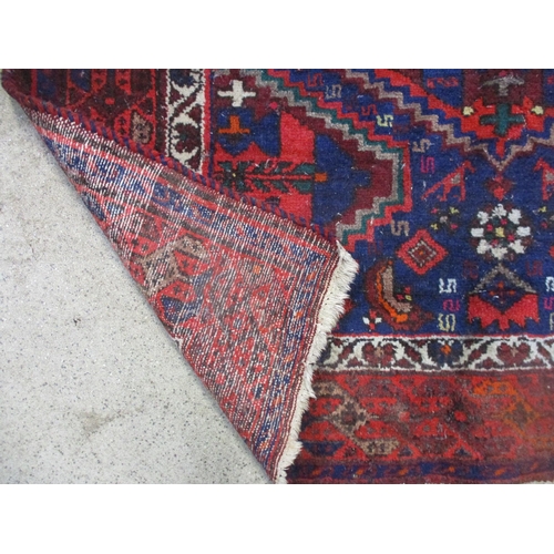 103 - A Persian handwoven blue ground rug, triple guard borders 203cm x 137cm, and one other A/F Location:... 