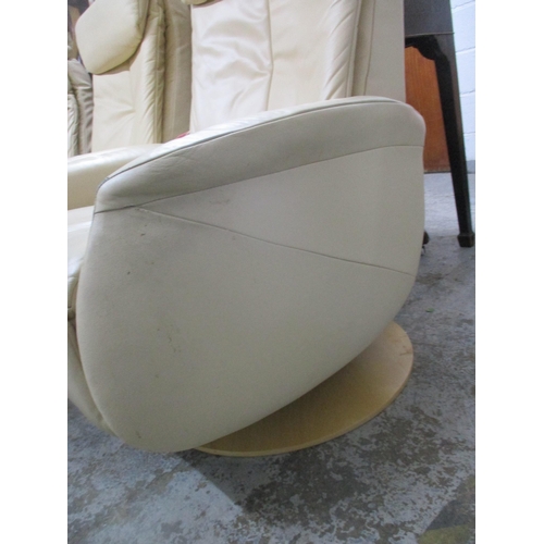 181 - Three cream leather reclining armchairs on circular swivel bases, two with power packs Location:G