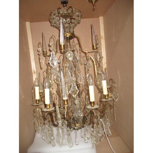 210 - A pair of large gilt brass and glass chandeliers having eight candle bulb branches with alternating ... 