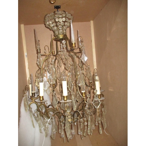 210 - A pair of large gilt brass and glass chandeliers having eight candle bulb branches with alternating ... 