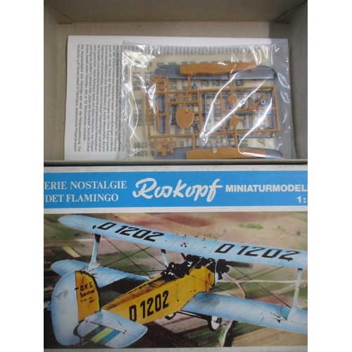 211 - A group of four boxed German model airplane kits to include a Heller Humbrol Fieseler Storch Fi 156/... 