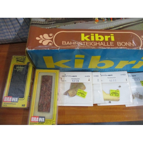 212 - A group of German HO model railway kits to include a Kibri model shed B-9462, Train Shed B-9522, and... 