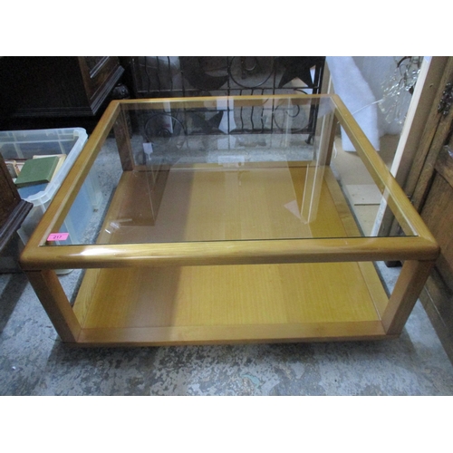 217 - A late 20th century oak two tier glass topped coffee table and a metal fire guard 
Location: G