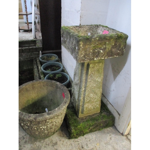 80 - A group of weathered garden concrete planters and a bird bath on tapering column and square base, to... 
