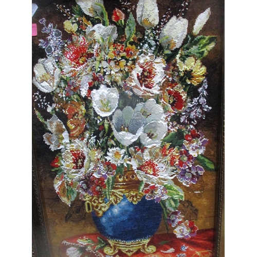 94 - A contemporary Mirne Zomi picture carpet depicting a vase of flowers 61cm x 38cm mounted in a gilt f... 