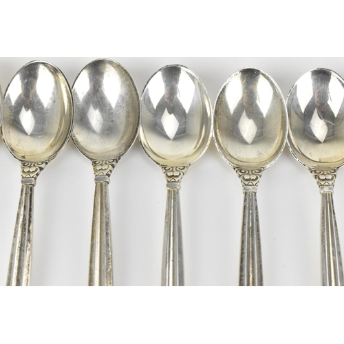 10 - A boxed set of nine Danish silver teaspoons by Georg Jensen, designed by Johan Rodhe, in the acorn p... 