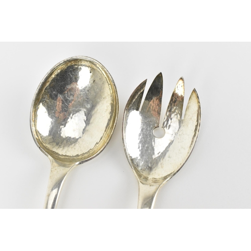 11 - A pair of Norwegian dragestil silver salad servers by Magnus Aase, circa 1930s, with hammered bowls,... 