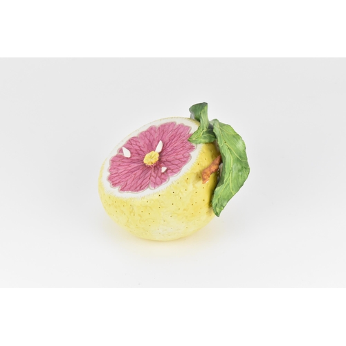 14 - Katherine Houston (contemporary) American, a ceramic model of a grapefruit, realistically rendered, ... 