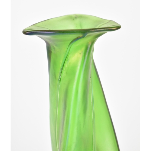 21 - An Art Nouveau kralik style iridescent green vase, of twisted triform with applied drop trails, with... 