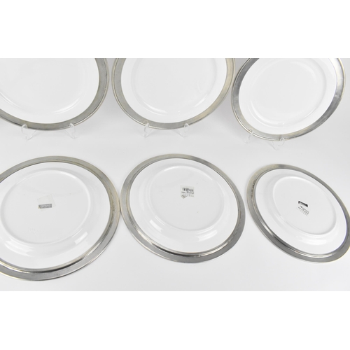 24 - A set of six Italian Match pewter mounted dinner plates, in the Convivio collection, white ceramic w... 