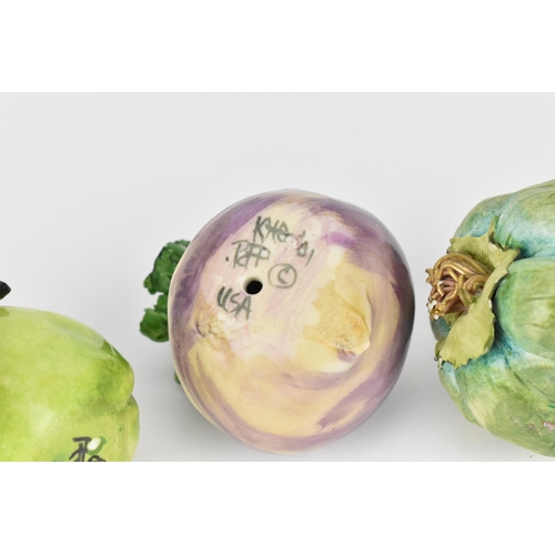 26 - Katherine Houston (contemporary) American, a small collection of ceramic vegetables and fruit, compr... 