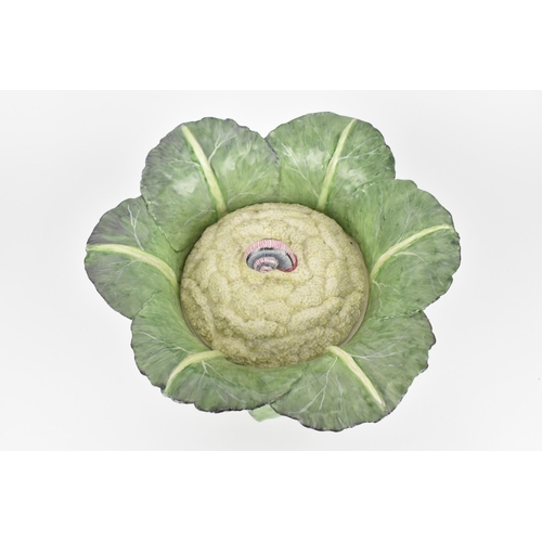 34 - A large studio ceramic trompe l'oeil pot, realistically rendered as a cauliflower in its leaf, the l... 