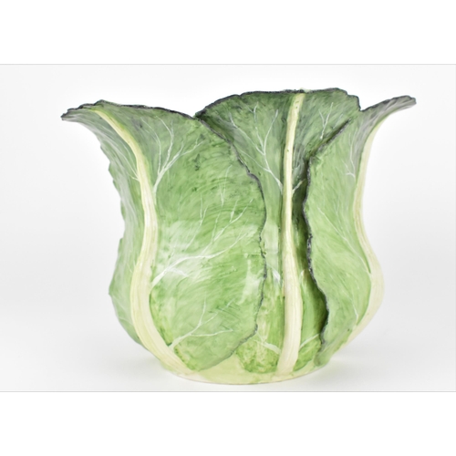 34 - A large studio ceramic trompe l'oeil pot, realistically rendered as a cauliflower in its leaf, the l... 