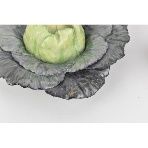 35 - Two studio ceramic trompe l'oeil vegetables, to include a green cabbage and a chicory, both by the s... 