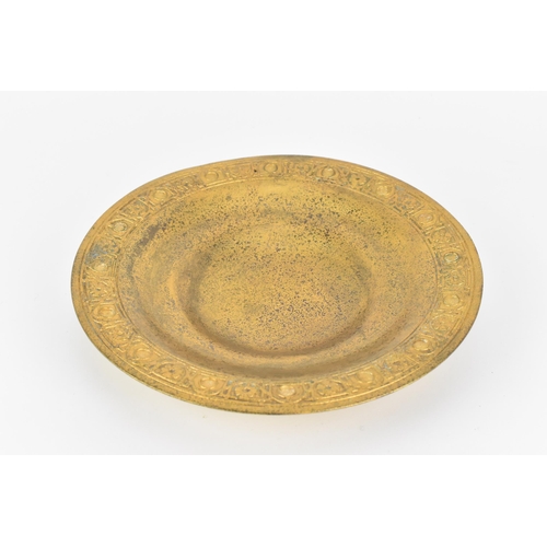 38 - A Tiffany Studios dore bronze circular bowl, with flared rim, mottled gilt finish, the edge with geo... 