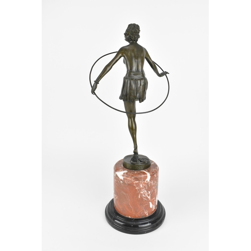 39 - After Dominic Alonzo: a large Art Deco style bronze figure of a hoop girl, with cast signature 'D. A... 