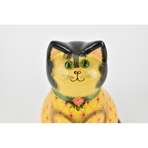 5 - Joan and David De Bethel - A 1970s papier-mâché model of a seated cat, with bead eyes, the back with... 