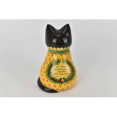 5 - Joan and David De Bethel - A 1970s papier-mâché model of a seated cat, with bead eyes, the back with... 