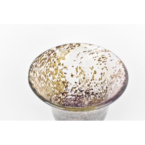 54 - A hand blown studio glass vase by Dan Aston, with everted rim and speckled lilac body, the underside... 