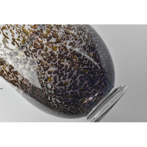 54 - A hand blown studio glass vase by Dan Aston, with everted rim and speckled lilac body, the underside... 