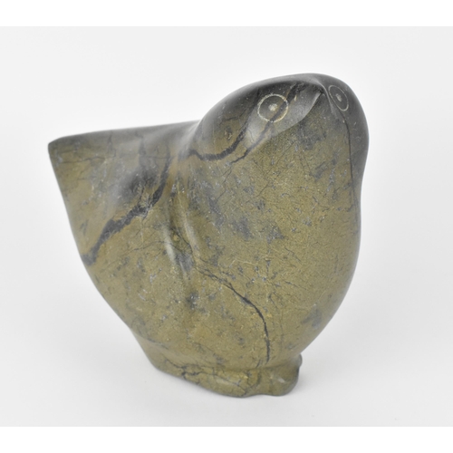 63 - An Inuit steatite stone carving of a bird, by a Cape Dorset artist, circa 1970s/80s, the underside w... 