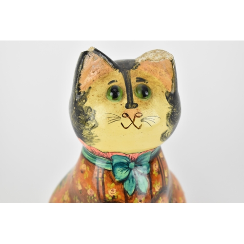 7 - Joan and David De Bethel - A 1960s papier-mâché  model of a seated cat, with bead eyes, the back wit... 