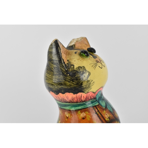 7 - Joan and David De Bethel - A 1960s papier-mâché  model of a seated cat, with bead eyes, the back wit... 