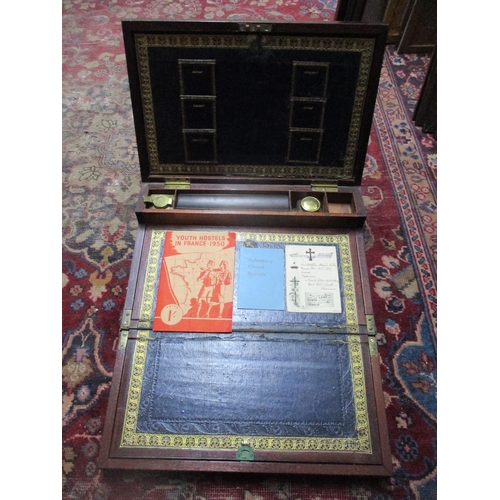 236 - A 19th century mahogany campaign writing box, inset brass carrying handle, cartouche and edges, fitt... 