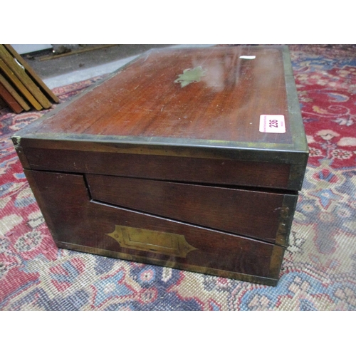 236 - A 19th century mahogany campaign writing box, inset brass carrying handle, cartouche and edges, fitt... 