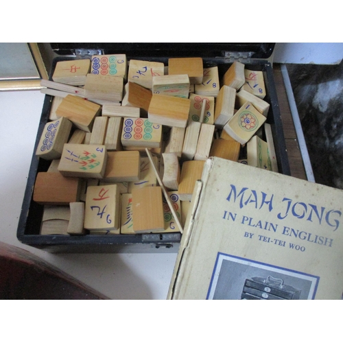 244 - A mixed lot to include a Mah Jong game with bamboo tiles in a Chinese lacquered box, with books on h... 