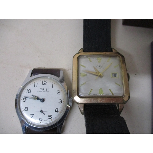 245 - A group of vintage and modern ladies and gents wristwatches to include two Oris watches, one having ... 