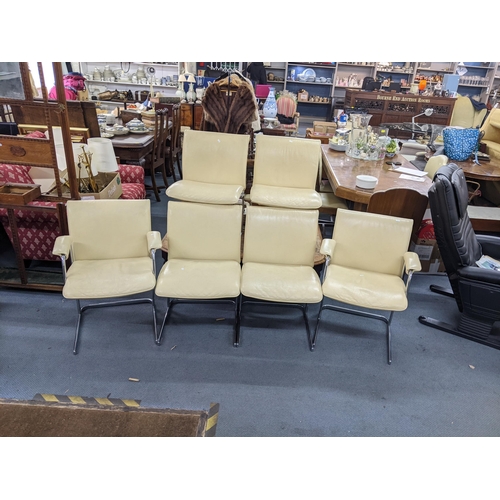 11 - A set of six Boss Design cream leather and chrome dining chairs, together with a Draenert Service gl... 