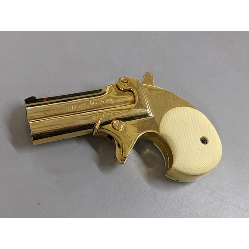 124 - A Derringer 6mm Starter Pistol, in gilt metal, with original box
Location: CAB5
