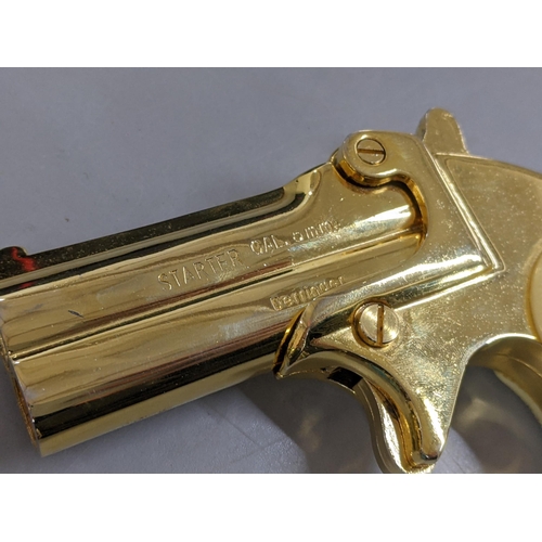 124 - A Derringer 6mm Starter Pistol, in gilt metal, with original box
Location: CAB5