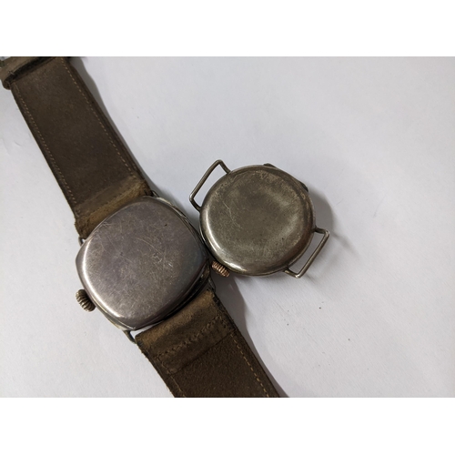 2 - A WWI silver cased trench watch fitted with a strap, together with another silver cased trench watch... 