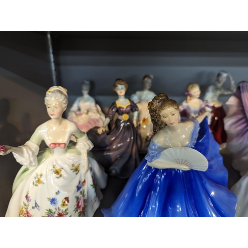 262 - A collection of 12 figures of ladies, mostly Royal Doulton examples, to include Isadora, Diana, Vani... 