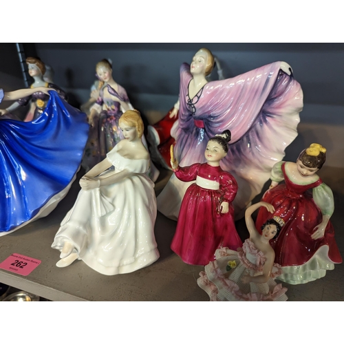 262 - A collection of 12 figures of ladies, mostly Royal Doulton examples, to include Isadora, Diana, Vani... 