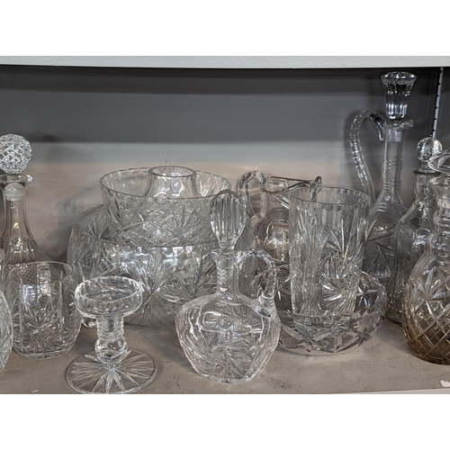 266 - A quantity of mixed domestic glassware to include glasses, bowls, footed bowl, jugs, decanters and o... 