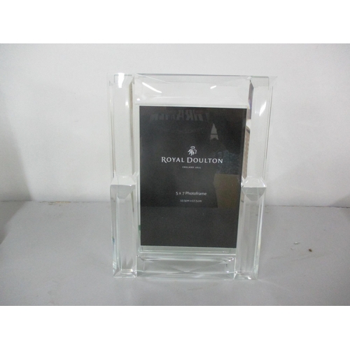 27 - A Royal Doulton photo frame 12.5cm x 17.5cm, together with two Royal Doulton stoneware vases and a b... 