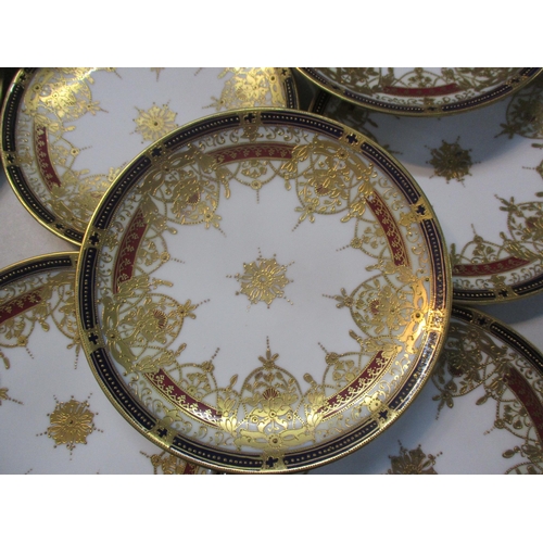 30 - A Noritake part dinner service having heavy gilded decoration on a white ground Location:9.6