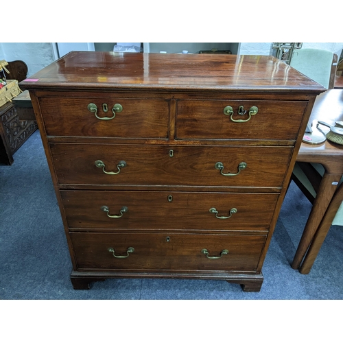 397 - A Georgian mahogany chest of two short and three long drawers having brass swan neck handles and on ... 