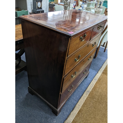 397 - A Georgian mahogany chest of two short and three long drawers having brass swan neck handles and on ... 