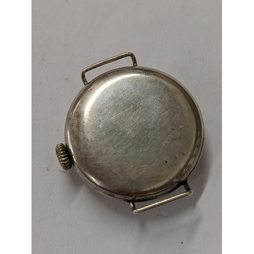 4 - A WWI silver cased trench watch having a white enamel dial with Arabic numerals Location:cab5