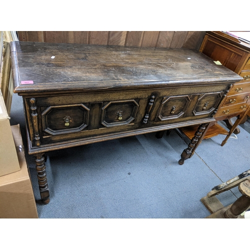 407 - An early oak side table having two drawers and on bobbin turned front legs, 84cm h x 121cm w
Locatio... 