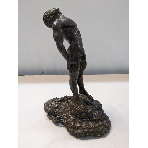 473 - A D - a 20th century patinated lead figure of a nude man on a rocky base, 19cm h
Location: 9:1