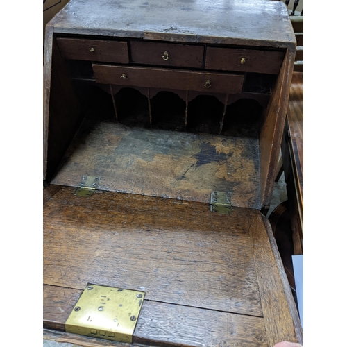 78 - An 18th century oak bureau of small proportions with four drawers on bracket feet 101cm x 52cm x 46.... 