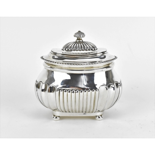 487 - An Edwardian silver tea caddy by Charles Stuart Harris, London 1902, with gadrooned rim, fluted fini... 