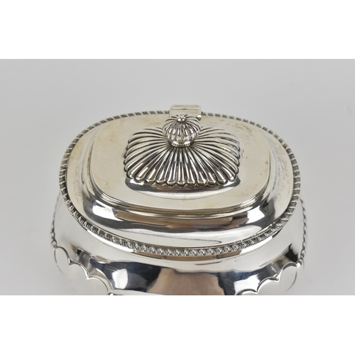 487 - An Edwardian silver tea caddy by Charles Stuart Harris, London 1902, with gadrooned rim, fluted fini... 