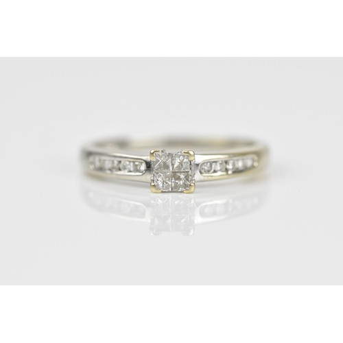 492 - An 18ct white gold and diamond engagement ring, with central four section diamond flanked with a row... 