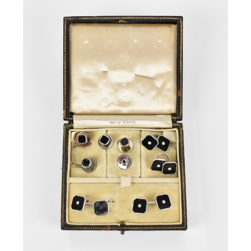 494 - A set of Art Deco black 9ct white gold, black enamel and seed pearl cufflinks, buttons and shirt stu... 